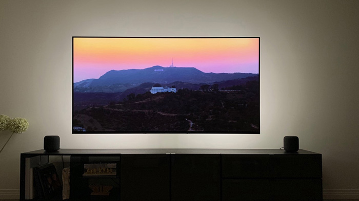 A flat screen tv sitting in front of a television Description automatically generated